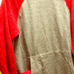 Soft grey and red pullover.
